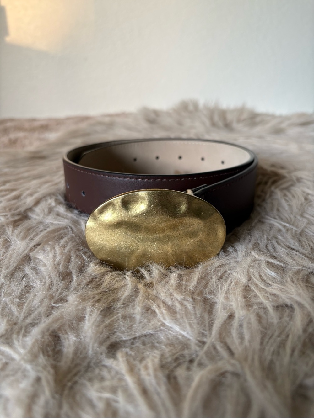 Brown belt with hammer gold buckle